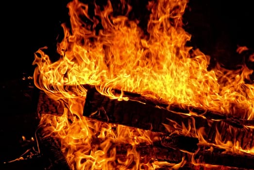 Large campfire at night while camping