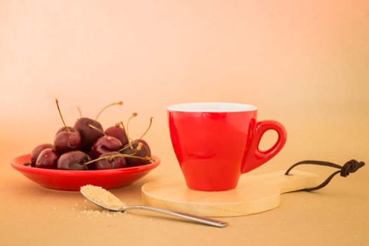 Beautiful breakfast of red coffee cup and cherries, stock photo