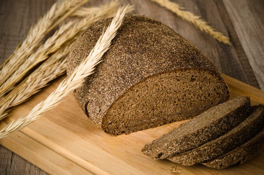 Black homemade bread and rye cones, close-up