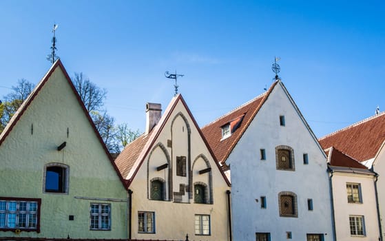 Narrow street in the Old Town of Tallinn with colorful facades, Estonia