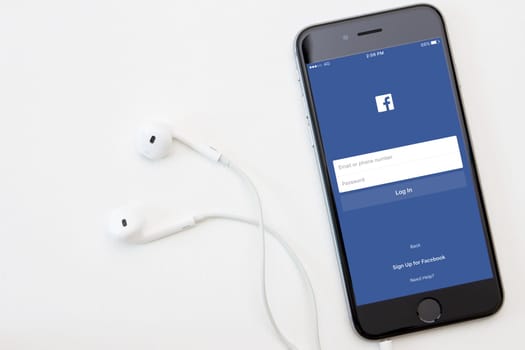Bangkok, Thailand - jan 5, 2016 : facebook application on iphone operation, facebook is social network for connection people open source download on ios. facebook app developed by facebook, Inc.