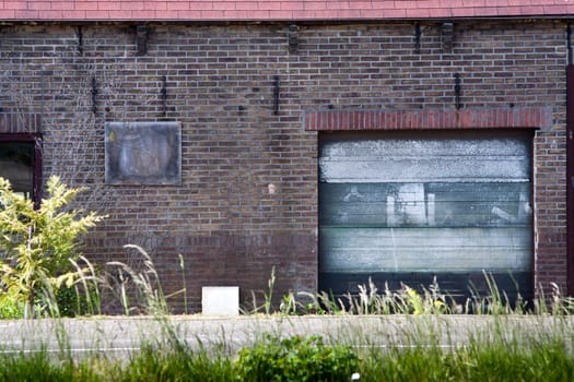 Brick wall with a grunge garage door