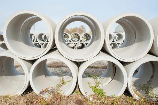Concrete drainage pipes for industrial building construction.