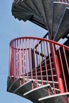 Red metal spiral staircase in the Netherlands
