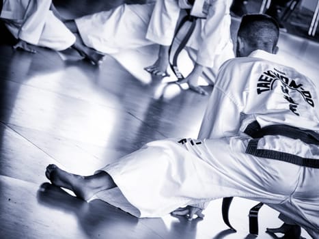 master trains his students. Training of Taekwon-do for kids