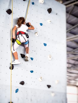 free climbing kids. Demonstration of training of indoor free climbing
