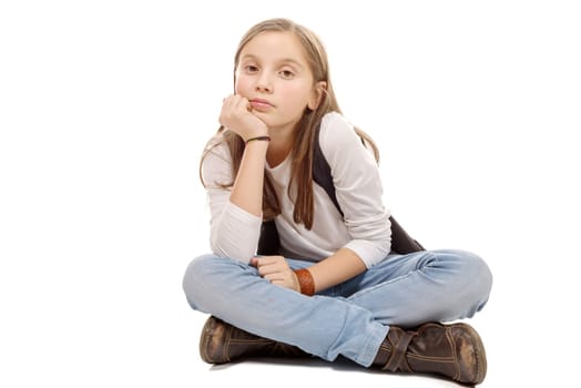 a closeup image of a pretty little girl sitting on the floor. Isolated on white background