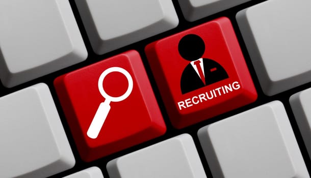 Red keyboard with magnifying glass shows recruiting