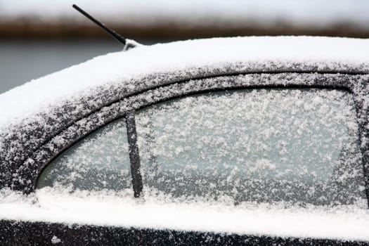 Cold snowy car in winter