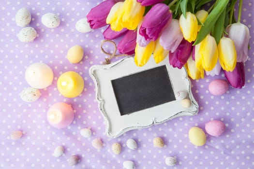 Vintage table with colorful Easter eggs on dotted background