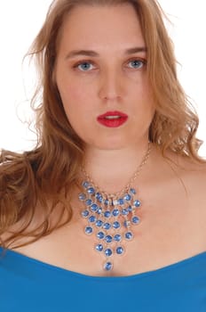 A closeup image of a blond woman in a blue dress with a beautiful necklace.of blue stones, isolated for white background..
