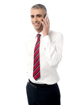 Male executive talking in mobile phone over white