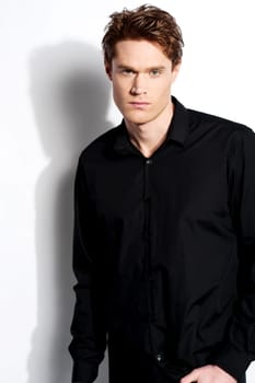 Young stylish man with attitude over white