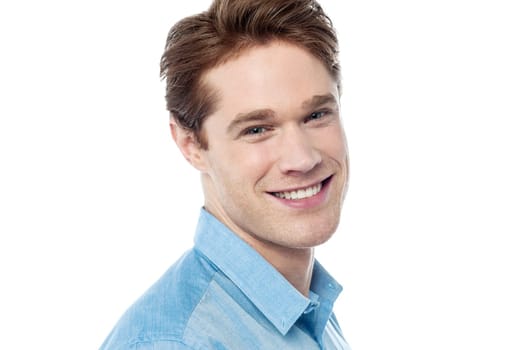 Happy young man posing against white background