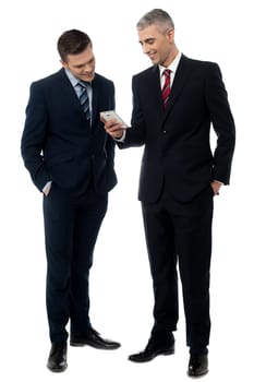 Businessmen discussing about mobile application over white