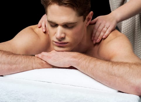 Man enjoying a wellness back massage in a spa