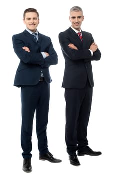 Confident young businessmen posing with crossed arms