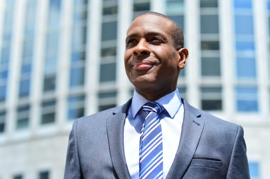 Image of a Business man outside modern building