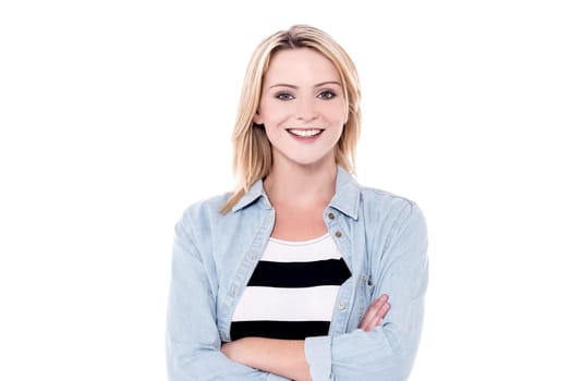 Casual woman with crossed arms over white