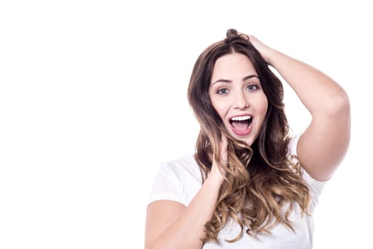Expressive woman looking at camera over white
