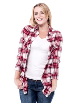 Stylish woman posing to camera with hands in pockets