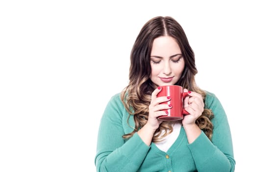 Beautiful smiling woman with a cup of coffee
