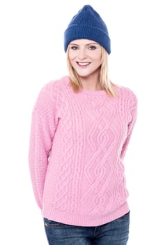 Pretty lady posing with blue winter cap