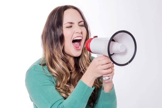 Woman screaming on a megaphone, isolated over white