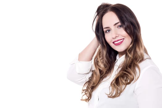 Beauty portrait of young woman touching her hair