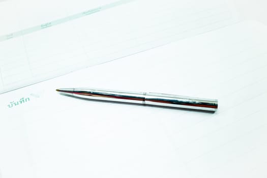 Metallic pen and recording paper, stock photo
