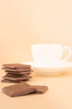 White mug of hot coffee and chocolate pieces, stock photo