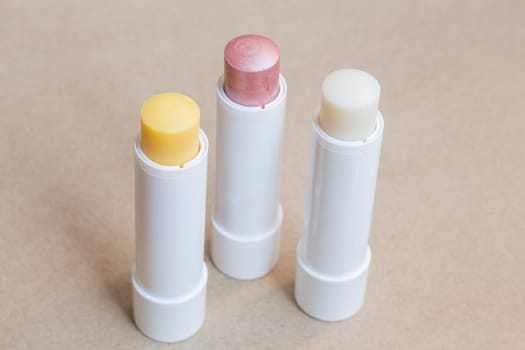 Moisturizer lipstick on brown natural background, stock photo