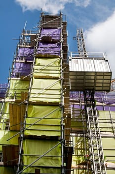 Scaffolding with protection nets on a construction site