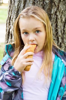 Photo of eating cute girl with blond hair