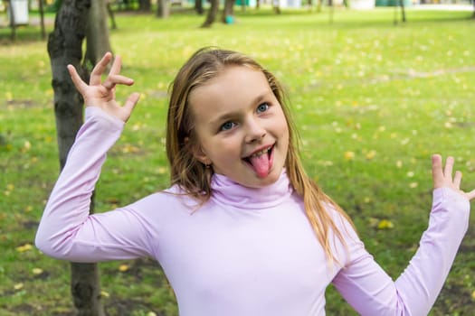 Portrait of cute girl with put out tongue
