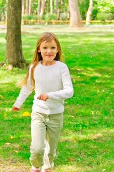 Photo of cute running girl in summer