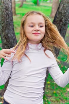 Photo of cute playing girl in summer