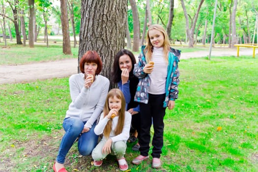 Photo of group people are eating in summer