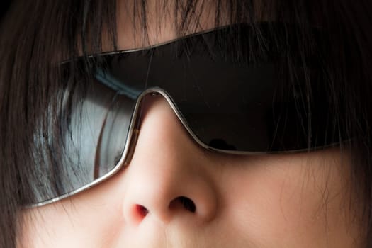 Photo of brunette woman face in sunglass