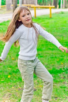 Photo of cute playing girl in summer