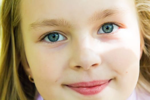 Photo of cute girl with big blue eyes