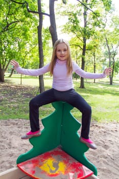 Portrait of cute smiling girl with blond hair