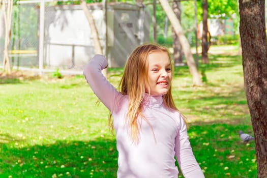 Photo of cute playing girl in summer
