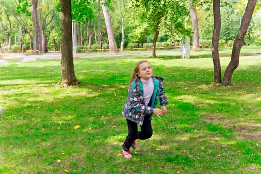 Photo of cute running girl in summer