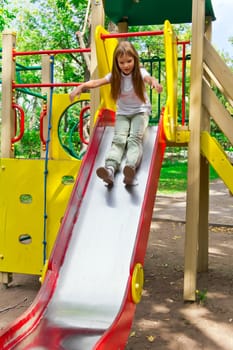 Photo of active girl on nursery platform in summer