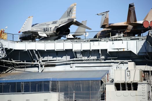 San Diego,United States - December 25,2015: Three old warplanes stand on the deck of the aircraft carrier and museum ship MSS Midway at Navy Pier on December 25,2015 in the Port of San Diego.