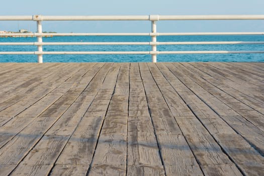 Wooden Boardwalk Next To The Beach.