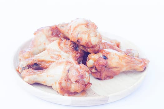 Grilled chicken wings isolated on white background, stock photo