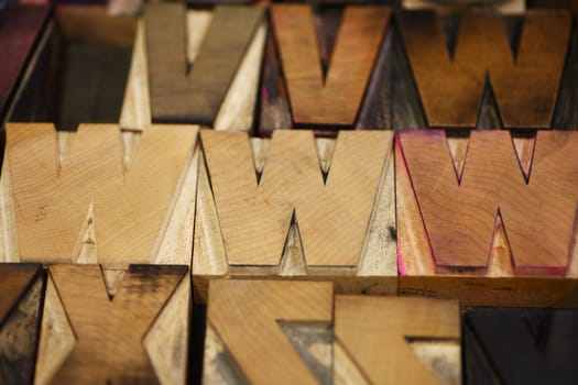 Old letterpress capital letters in a bold font