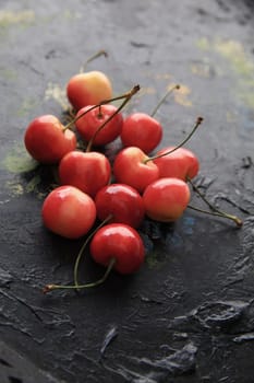 Sweet Rainier cherries on an old painted tray